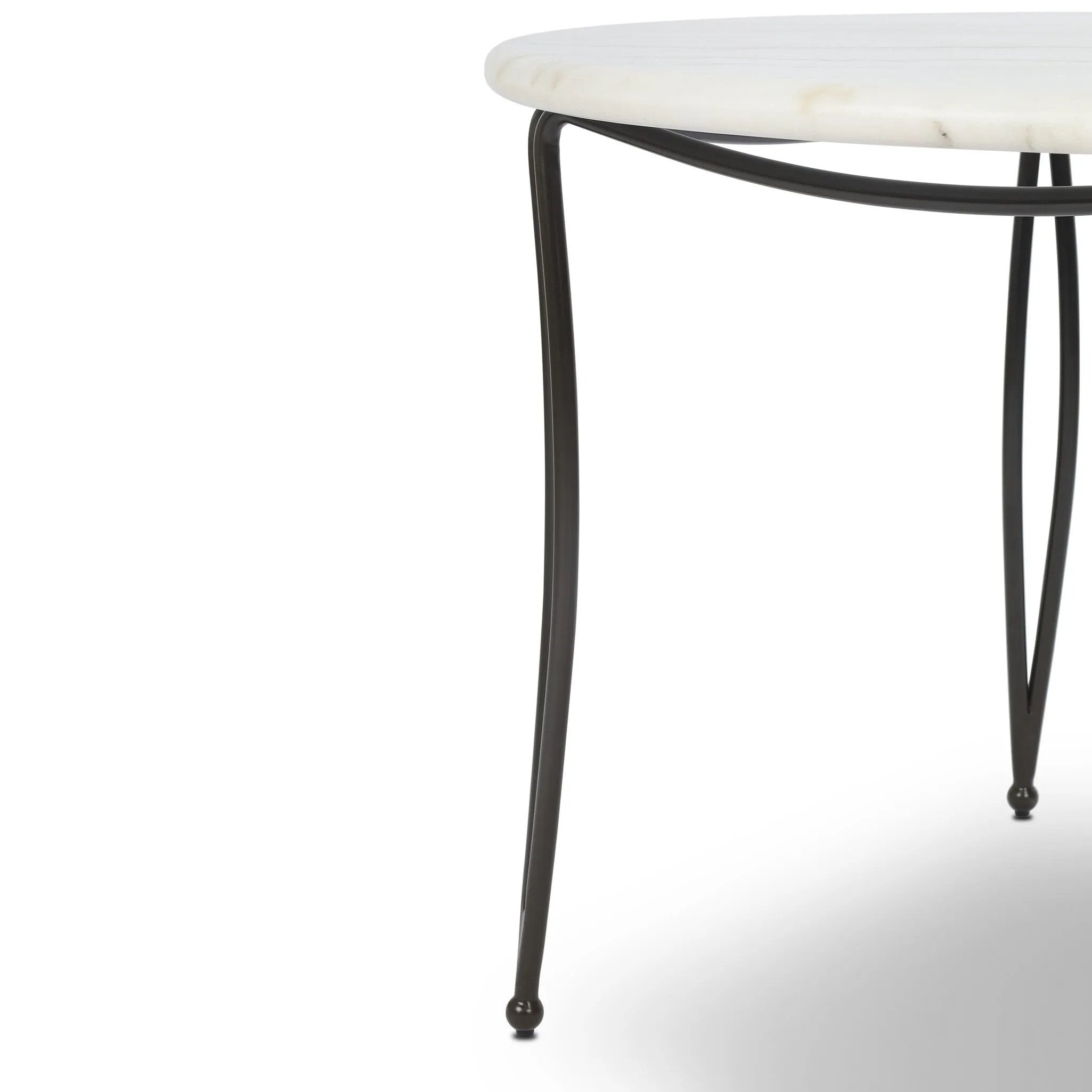 Inspired by Art Deco designs, this outdoor bistro dining table introduces a sense of movement to a classic silhouette. Graceful, flowing lines on the base pair with a white marble top for a classic black-and-white look. Cover or store inside during inclement weather and when not in use. Amethyst Home provides interior design, new home construction design consulting, vintage area rugs, and lighting in the Houston metro area.