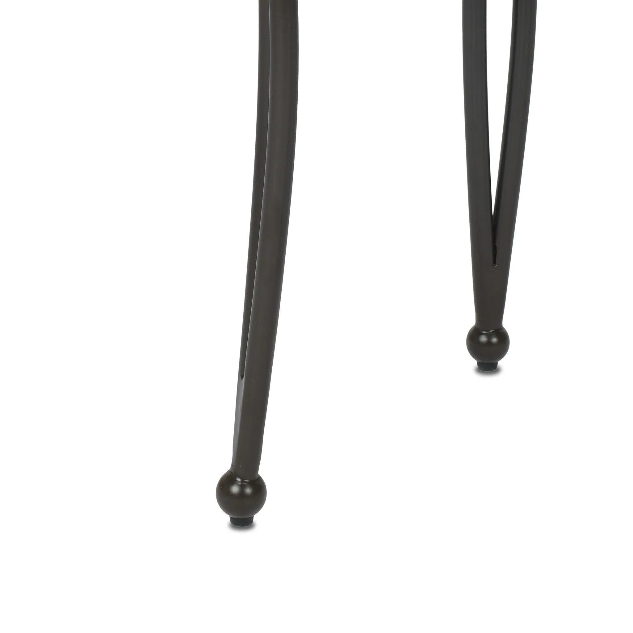Inspired by Art Deco designs, this outdoor end table introduces a sense of movement to a classic silhouette. Graceful, flowing lines on the base pair with a white marble top for a classic black-and-white look. Cover or store inside during inclement weather and when not in use. Amethyst Home provides interior design, new home construction design consulting, vintage area rugs, and lighting in the Laguna Beach metro area.