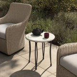 Inspired by Art Deco designs, this outdoor end table introduces a sense of movement to a classic silhouette. Graceful, flowing lines on the base pair with a white marble top for a classic black-and-white look. Cover or store inside during inclement weather and when not in use. Amethyst Home provides interior design, new home construction design consulting, vintage area rugs, and lighting in the Salt Lake City metro area.