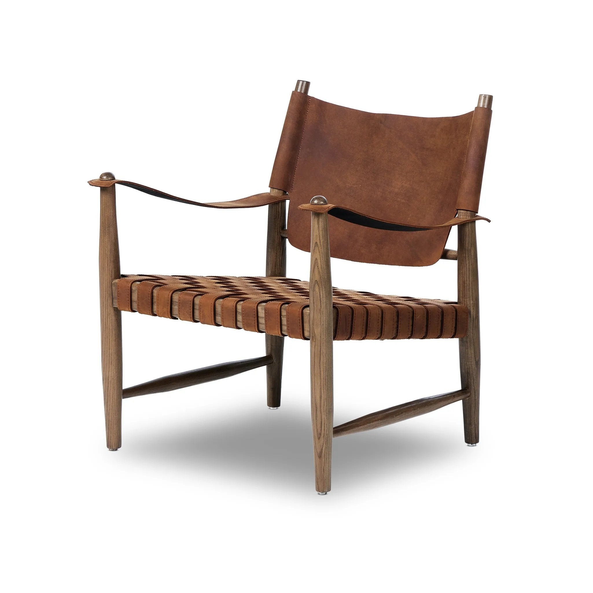 Reviving a vintage-inspired frame, this leather sling chair meets retro character with laid-back comfort. The tan leather sling back, shaped like a shield, adds bold style, while the woven seat provides a supportive, unique seating experience. Amethyst Home provides interior design, new home construction design consulting, vintage area rugs, and lighting in the Houston metro area.