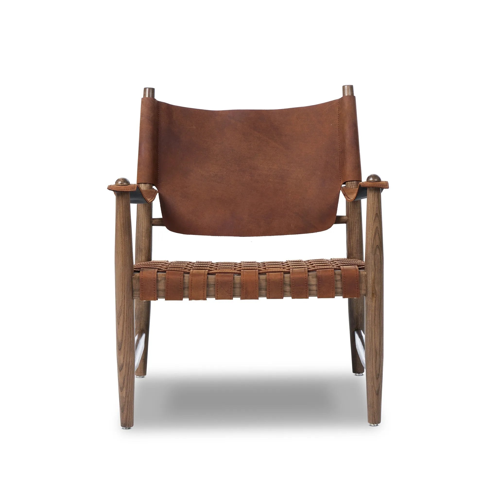 Reviving a vintage-inspired frame, this leather sling chair meets retro character with laid-back comfort. The tan leather sling back, shaped like a shield, adds bold style, while the woven seat provides a supportive, unique seating experience. Amethyst Home provides interior design, new home construction design consulting, vintage area rugs, and lighting in the Laguna Beach metro area.