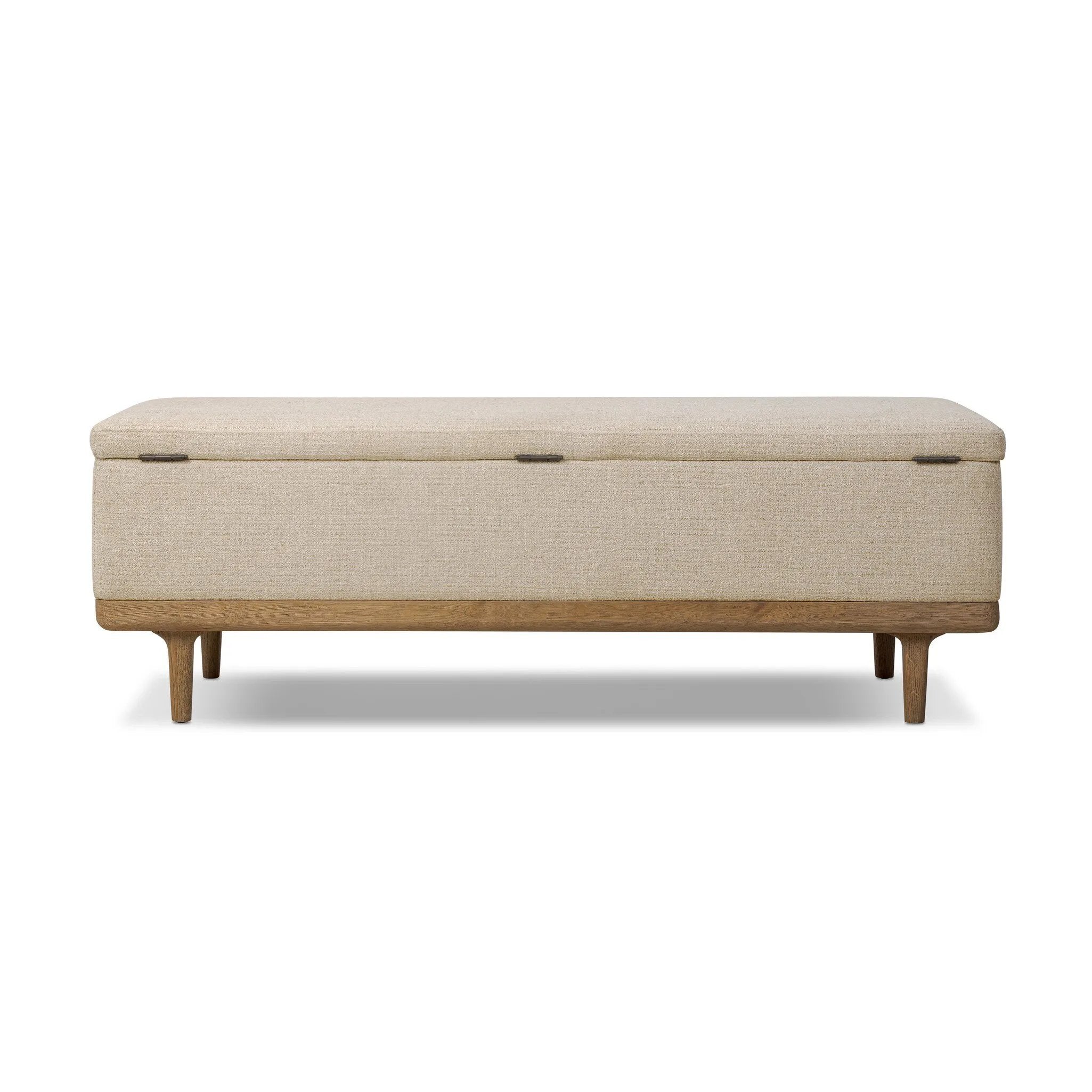 Wrapped in textural cream performance fabric, this spacious trunk doubles as seating at the foot of the bed — or anywhere. Store extra blankets, linens and more. Crafted from oak, the frame and tapered legs with Deco vibes are finished in a worn oak finish. Amethyst Home provides interior design, new home construction design consulting, vintage area rugs, and lighting in the Boston metro area.