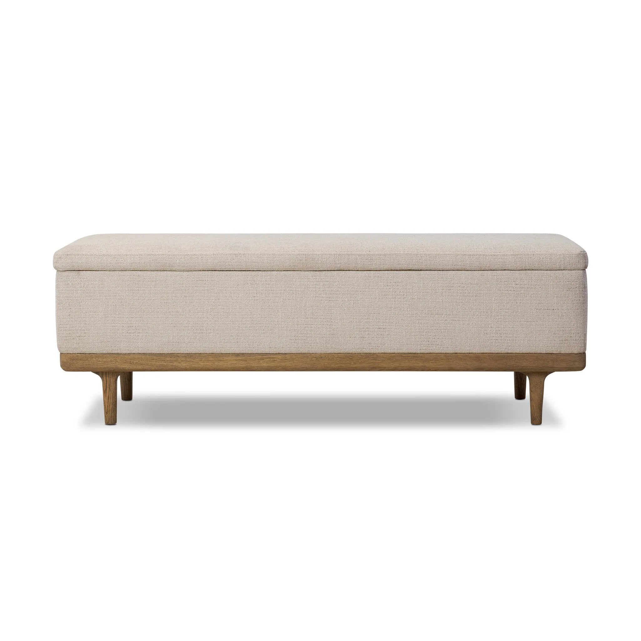 Wrapped in textural cream performance fabric, this spacious trunk doubles as seating at the foot of the bed — or anywhere. Store extra blankets, linens and more. Crafted from oak, the frame and tapered legs with Deco vibes are finished in a worn oak finish. Amethyst Home provides interior design, new home construction design consulting, vintage area rugs, and lighting in the Washington metro area.