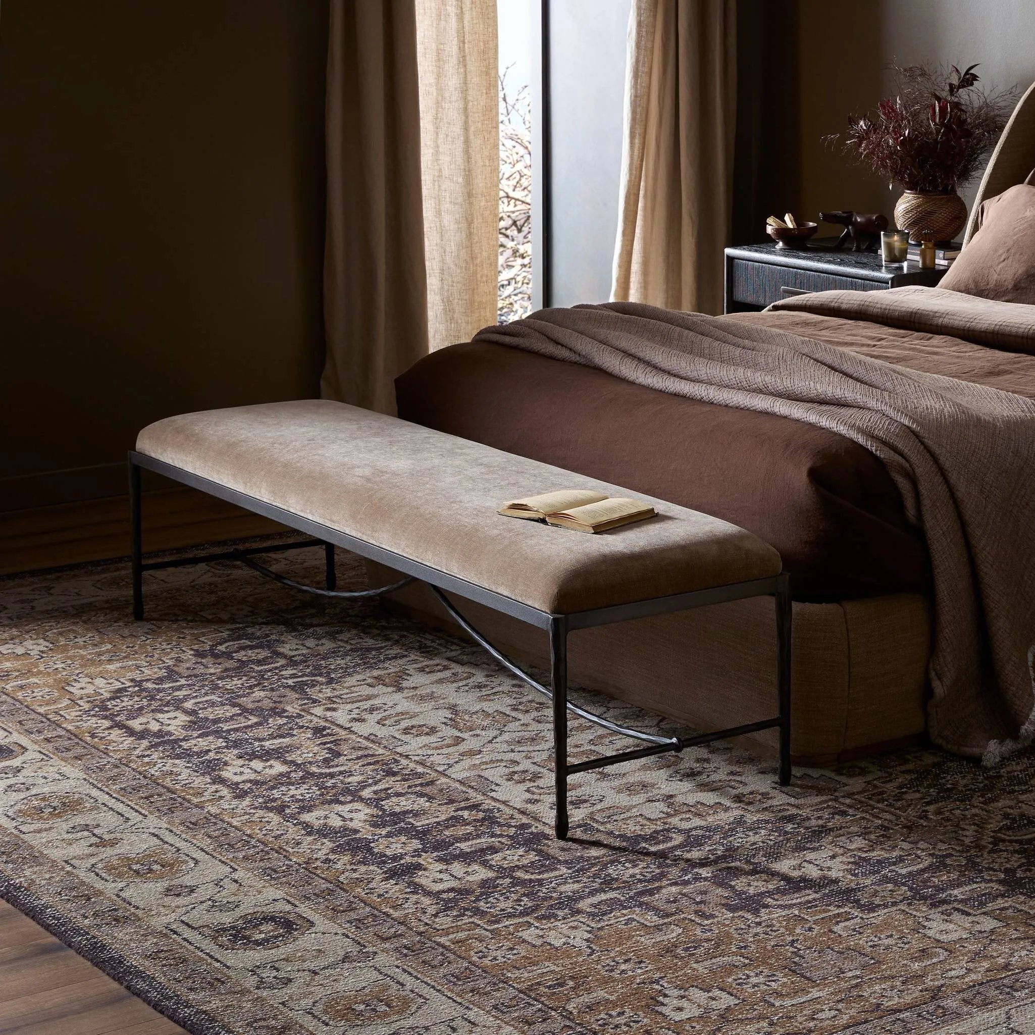 Channel Art Deco with a curved stretcher base of bronzed hammered iron and a velvety seat in a versatile earth tone. Style in the bedroom or entryway to create an extra surface, or in your living space for bonus seating Amethyst Home provides interior design, new home construction design consulting, vintage area rugs, and lighting in the Austin metro area.