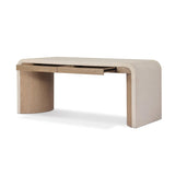A thick layer of beige painted linen cascades this desk's soft waterfall shape in an eye-catching combination of texture. Crafted atop a mahogany and oak veneer base with rounded corners, this hardworking piece elevates the home-office workspace Amethyst Home provides interior design, new home construction design consulting, vintage area rugs, and lighting in the Alpharetta metro area.