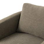 On-trend and expertly tailored, a texture-driven chair is upholstered in an olive flax/linen blend and wrapped with natural rattan, with linear iron legs finished in a complementary gunmetal Amethyst Home provides interior design, new home construction design consulting, vintage area rugs, and lighting in the Los Angeles metro area.