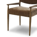 A midcentury-inspired piece brought to modern speed. A supportive, sling-style back and seat cushion are upholstered in a soft, velvety fabric, with toasted oak arms prime for the head of the table Amethyst Home provides interior design, new home construction design consulting, vintage area rugs, and lighting in the Alpharetta metro area.
