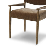 A midcentury-inspired piece brought to modern speed. A supportive, sling-style back and seat cushion are upholstered in a soft, velvety fabric, with toasted oak arms prime for the head of the table Amethyst Home provides interior design, new home construction design consulting, vintage area rugs, and lighting in the Alpharetta metro area.