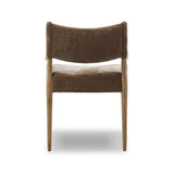A midcentury-inspired piece brought to modern speed. A supportive, sling-style back and seat cushion are upholstered in a soft, velvety fabric, with toasted oak arms prime for the head of the table Amethyst Home provides interior design, new home construction design consulting, vintage area rugs, and lighting in the Charlotte metro area.