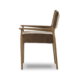 A midcentury-inspired piece brought to modern speed. A supportive, sling-style back and seat cushion are upholstered in a soft, velvety fabric, with toasted oak arms prime for the head of the table Amethyst Home provides interior design, new home construction design consulting, vintage area rugs, and lighting in the Miami metro area.
