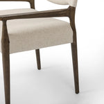 A midcentury-inspired piece, updated for modern times. A supportive back and seat cushion are upholstered in high-performance fabric, with walnut-finished wooden armrests prime for the head of the table. Steam regularly to keep fabric looking crisp. Amethyst Home provides interior design, new home construction design consulting, vintage area rugs, and lighting in the Alpharetta metro area.