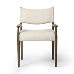 A midcentury-inspired piece, updated for modern times. A supportive back and seat cushion are upholstered in high-performance fabric, with walnut-finished wooden armrests prime for the head of the table. Steam regularly to keep fabric looking crisp. Amethyst Home provides interior design, new home construction design consulting, vintage area rugs, and lighting in the Boston metro area.