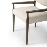 A midcentury-inspired piece, updated for modern times. A supportive back and seat cushion are upholstered in high-performance fabric, with walnut-finished wooden armrests prime for the head of the table. Steam regularly to keep fabric looking crisp. Amethyst Home provides interior design, new home construction design consulting, vintage area rugs, and lighting in the Nashville metro area.