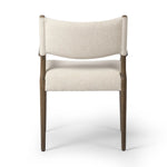A midcentury-inspired piece, updated for modern times. A supportive back and seat cushion are upholstered in high-performance fabric, with walnut-finished wooden armrests prime for the head of the table. Steam regularly to keep fabric looking crisp. Amethyst Home provides interior design, new home construction design consulting, vintage area rugs, and lighting in the Newport Beach metro area.