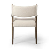 A midcentury-inspired piece, updated for modern times. A supportive back and seat cushion are upholstered in high-performance fabric, with walnut-finished wooden armrests prime for the head of the table. Steam regularly to keep fabric looking crisp. Amethyst Home provides interior design, new home construction design consulting, vintage area rugs, and lighting in the Newport Beach metro area.