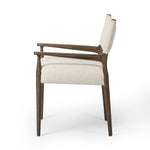 A midcentury-inspired piece, updated for modern times. A supportive back and seat cushion are upholstered in high-performance fabric, with walnut-finished wooden armrests prime for the head of the table. Steam regularly to keep fabric looking crisp. Amethyst Home provides interior design, new home construction design consulting, vintage area rugs, and lighting in the Washington metro area.