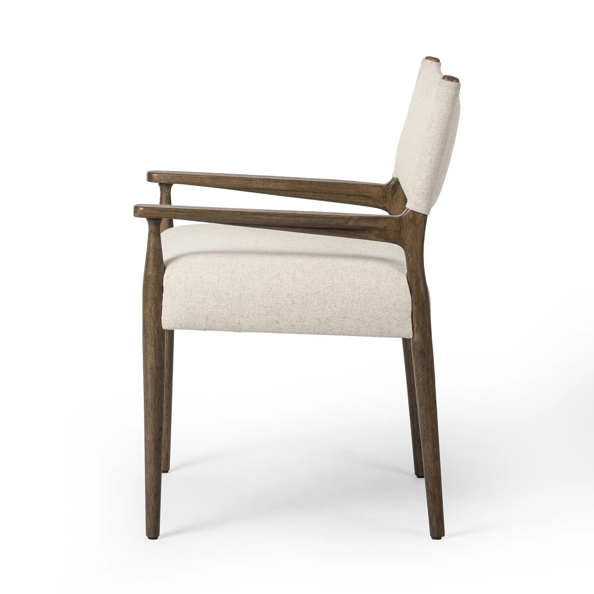 A midcentury-inspired piece, updated for modern times. A supportive back and seat cushion are upholstered in high-performance fabric, with walnut-finished wooden armrests prime for the head of the table. Steam regularly to keep fabric looking crisp. Amethyst Home provides interior design, new home construction design consulting, vintage area rugs, and lighting in the Washington metro area.