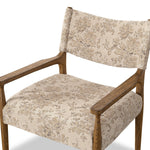 A midcentury-inspired piece brought to modern speed. A supportive, sling-style back and seat cushion are upholstered in a soft, velvety fabric, with toasted oak arms prime for the head of the table Amethyst Home provides interior design, new home construction design consulting, vintage area rugs, and lighting in the Miami metro area.