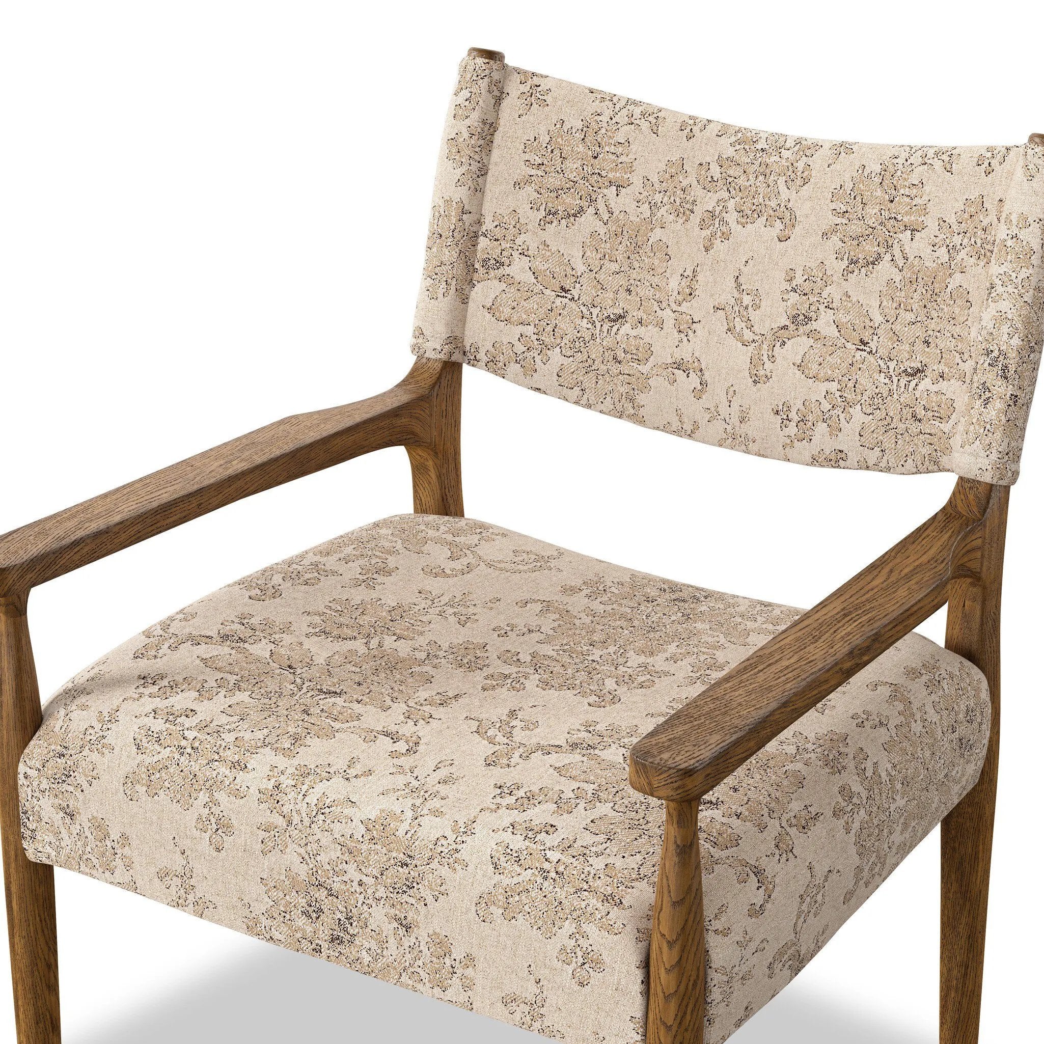 A midcentury-inspired piece brought to modern speed. A supportive, sling-style back and seat cushion are upholstered in a soft, velvety fabric, with toasted oak arms prime for the head of the table Amethyst Home provides interior design, new home construction design consulting, vintage area rugs, and lighting in the Miami metro area.