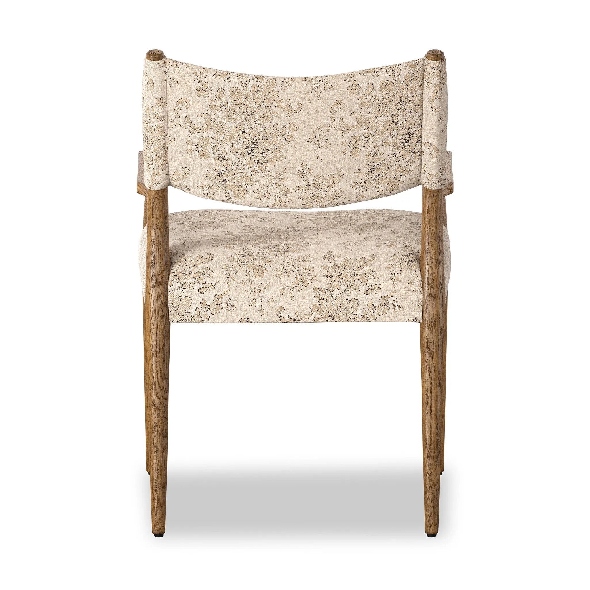 A midcentury-inspired piece brought to modern speed. A supportive, sling-style back and seat cushion are upholstered in a soft, velvety fabric, with toasted oak arms prime for the head of the table Amethyst Home provides interior design, new home construction design consulting, vintage area rugs, and lighting in the Tampa metro area.