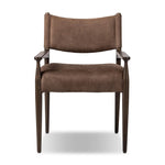 A midcentury-inspired piece brought to modern speed. A supportive, sling-style back and seat cushion are upholstered in a soft, velvety fabric, with toasted oak arms prime for the head of the table Amethyst Home provides interior design, new home construction design consulting, vintage area rugs, and lighting in the Austin metro area.