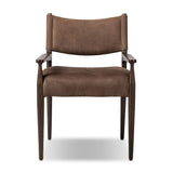 A midcentury-inspired piece brought to modern speed. A supportive, sling-style back and seat cushion are upholstered in a soft, velvety fabric, with toasted oak arms prime for the head of the table Amethyst Home provides interior design, new home construction design consulting, vintage area rugs, and lighting in the Austin metro area.