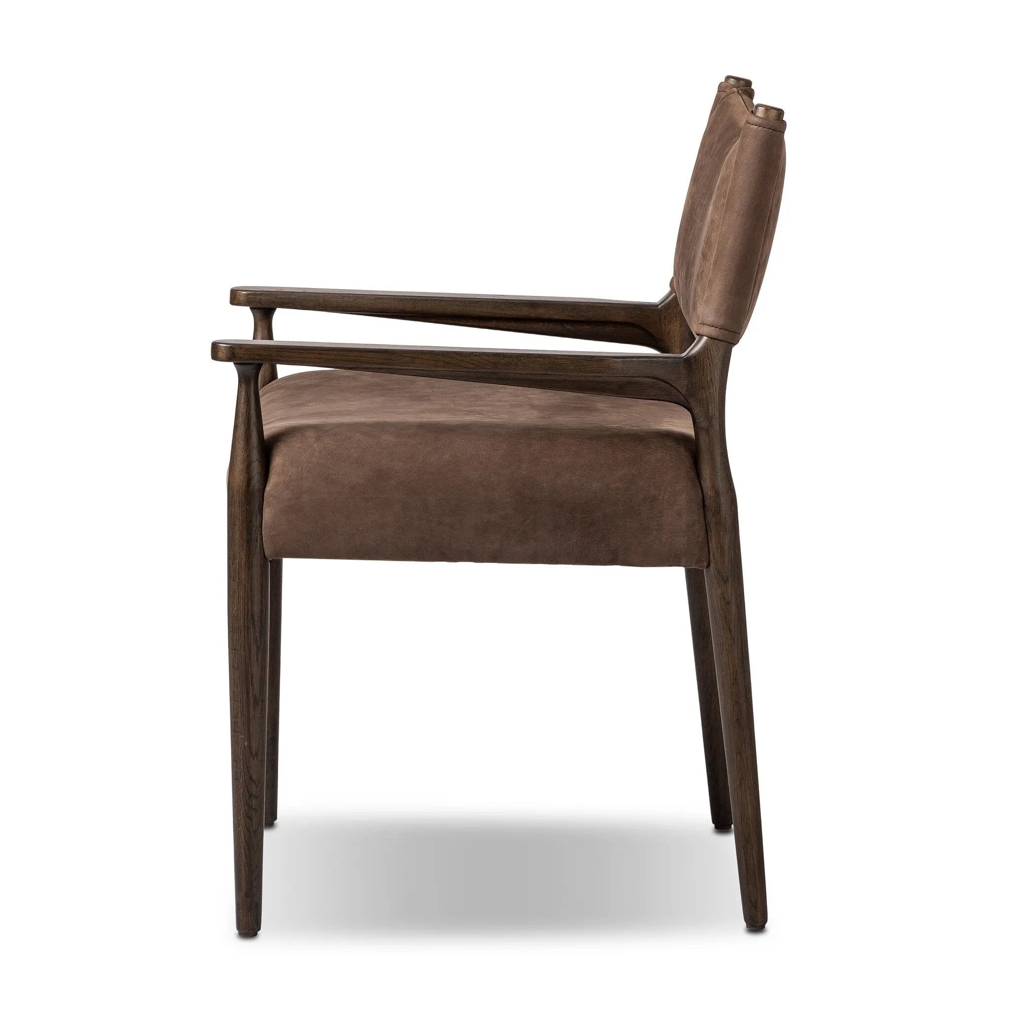 A midcentury-inspired piece brought to modern speed. A supportive, sling-style back and seat cushion are upholstered in a soft, velvety fabric, with toasted oak arms prime for the head of the table Amethyst Home provides interior design, new home construction design consulting, vintage area rugs, and lighting in the Omaha metro area.