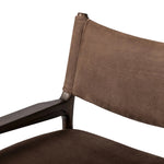 A midcentury-inspired piece brought to modern speed. A supportive, sling-style back and seat cushion are upholstered in a soft, velvety fabric, with toasted oak arms prime for the head of the table Amethyst Home provides interior design, new home construction design consulting, vintage area rugs, and lighting in the Portland metro area.