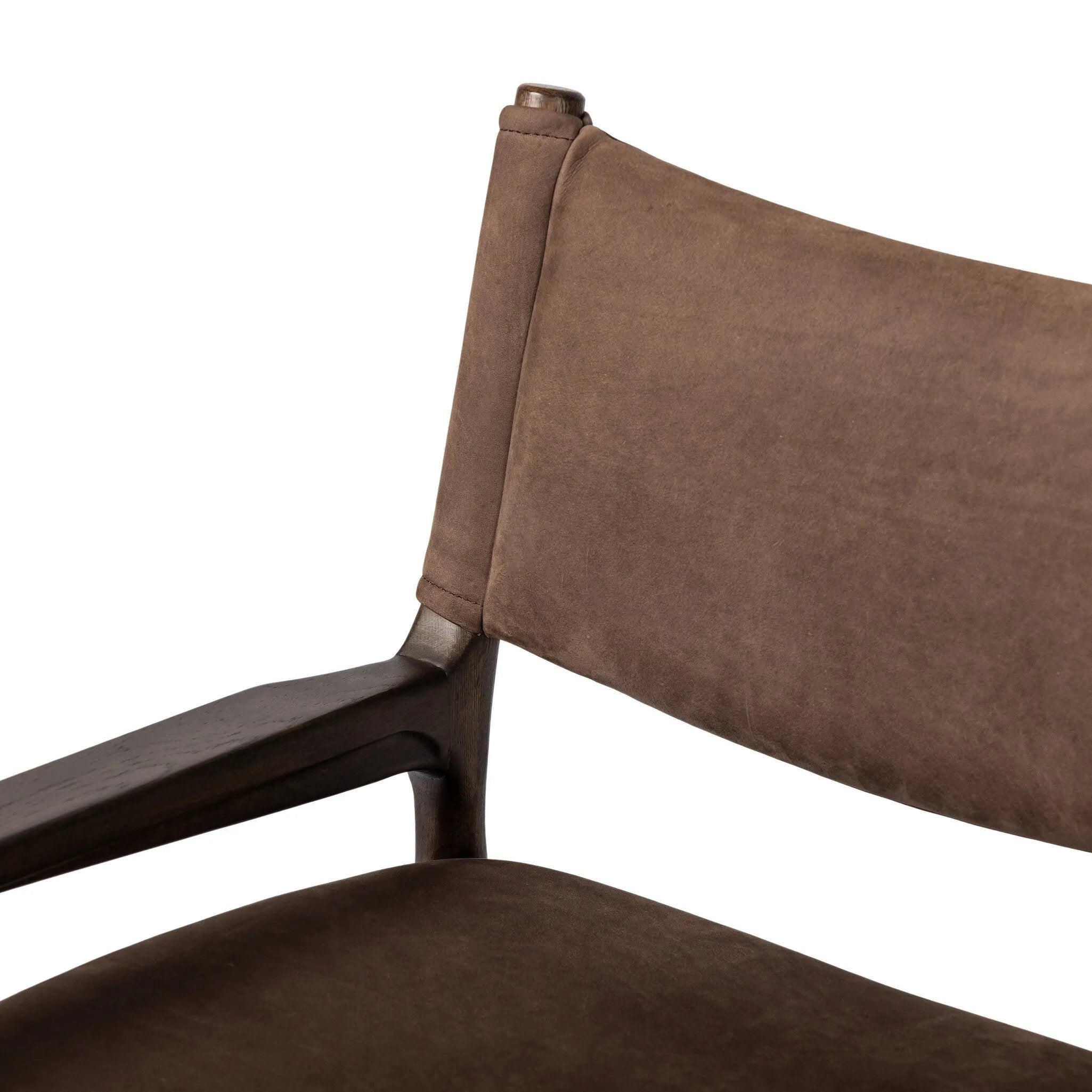 A midcentury-inspired piece brought to modern speed. A supportive, sling-style back and seat cushion are upholstered in a soft, velvety fabric, with toasted oak arms prime for the head of the table Amethyst Home provides interior design, new home construction design consulting, vintage area rugs, and lighting in the Portland metro area.