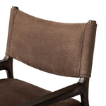 A midcentury-inspired piece brought to modern speed. A supportive, sling-style back and seat cushion are upholstered in a soft, velvety fabric, with toasted oak arms prime for the head of the table Amethyst Home provides interior design, new home construction design consulting, vintage area rugs, and lighting in the Seattle metro area.