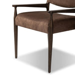 A midcentury-inspired piece brought to modern speed. A supportive, sling-style back and seat cushion are upholstered in a soft, velvety fabric, with toasted oak arms prime for the head of the table Amethyst Home provides interior design, new home construction design consulting, vintage area rugs, and lighting in the Winter Garden metro area.