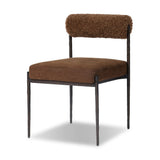 The armless dining chair gets a playful update with a bolstered cylinder seat back. Made from soft shearling and hammered met
