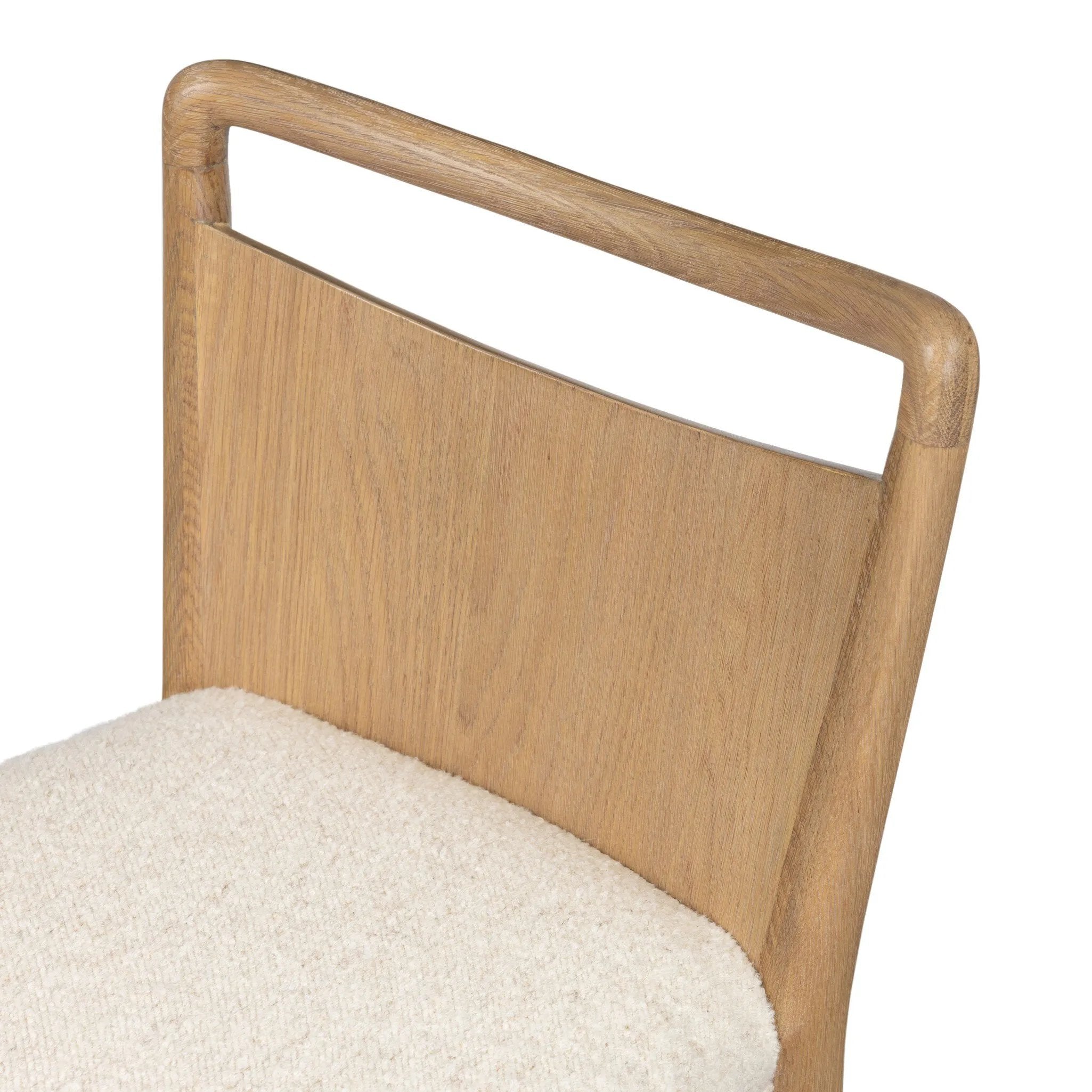 Bring a monochromatic, mixed-material look to the counter. Light solid oak shapes a curved seat back and sturdy frame for comfy seating upholstered with off-white performance fabric. A "handle" opening at the top of the seat back brings a touch of lightness to the look. Amethyst Home provides interior design, new home construction design consulting, vintage area rugs, and lighting in the Scottsdale metro area.