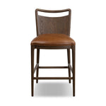 Bring a mixed-material look to the counter. Brown-finished solid oak shapes a curved seat back and sturdy frame for comfy seating upholstered with top-grain leather exclusive to Four Hands. A "handle" opening at the top of the seat back brings a touch of lightness to the look. Amethyst Home provides interior design, new home construction design consulting, vintage area rugs, and lighting in the Alpharetta metro area.