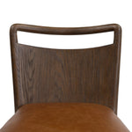 Bring a mixed-material look to the counter. Brown-finished solid oak shapes a curved seat back and sturdy frame for comfy seating upholstered with top-grain leather exclusive to Four Hands. A "handle" opening at the top of the seat back brings a touch of lightness to the look. Amethyst Home provides interior design, new home construction design consulting, vintage area rugs, and lighting in the Kansas City metro area.