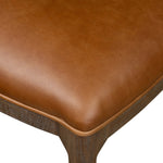Bring a mixed-material look to the counter. Brown-finished solid oak shapes a curved seat back and sturdy frame for comfy seating upholstered with top-grain leather exclusive to Four Hands. A "handle" opening at the top of the seat back brings a touch of lightness to the look. Amethyst Home provides interior design, new home construction design consulting, vintage area rugs, and lighting in the Seattle metro area.