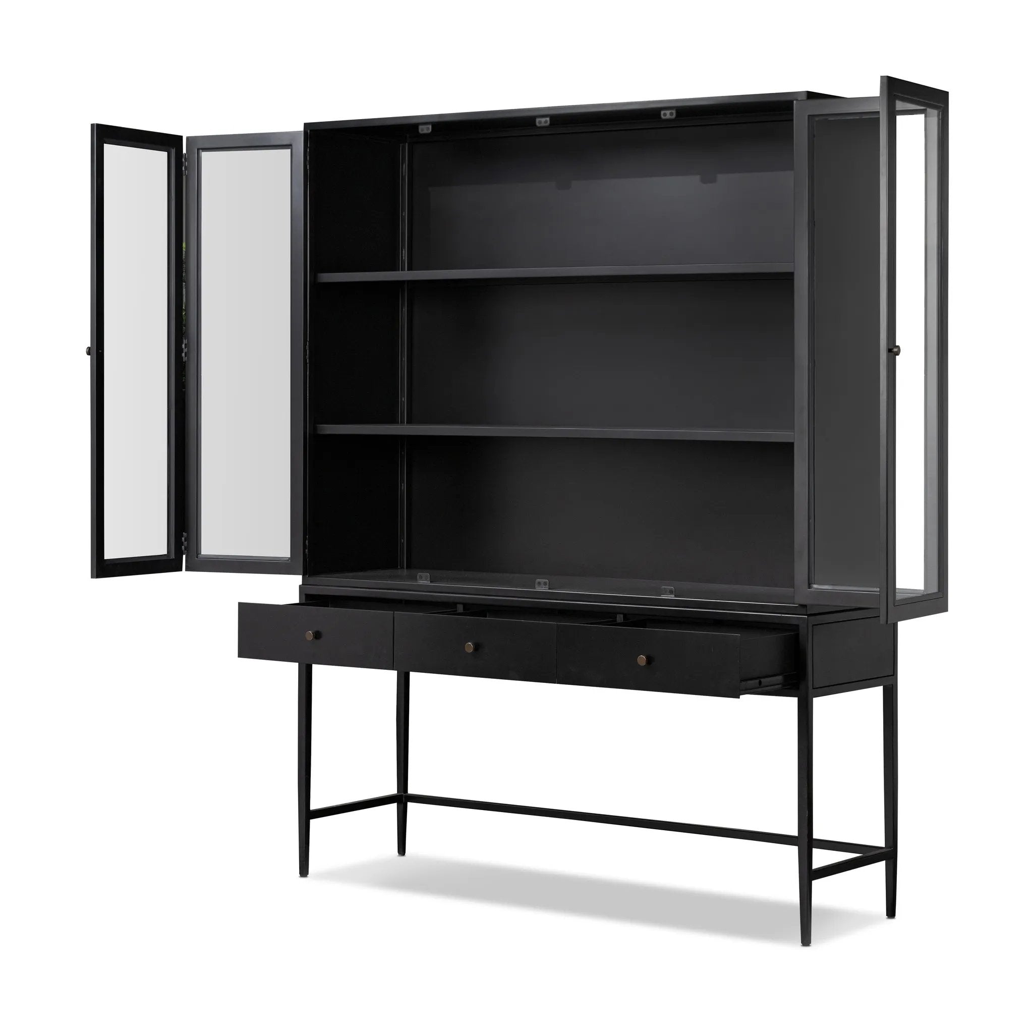 Featuring Jimi Black Cabinet by Four Hands at Amethyst Home. Storage-driven cabinetry inspired by angular geometry. Rich with monochromatic presence, a black-finished metal cabinet pairs with an airy iron base for a balance in scale. Three drawers bring even more storage, with bi-fold glass doors for display options. Minimalist bronzed hardware completes th. Amethyst Home provides interior design, new home construction design consulting, vintage area rugs, and lighting in the Calabasas metro area.