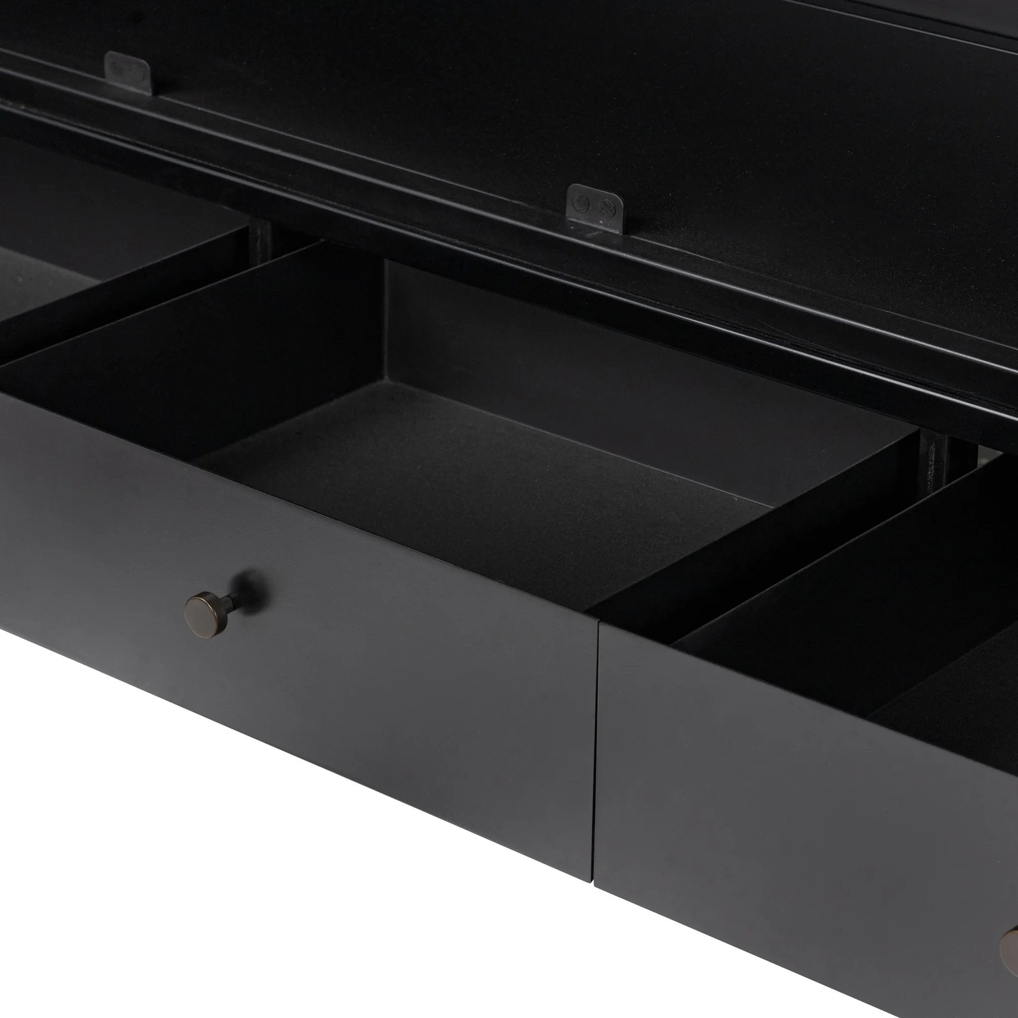 Featuring Jimi Black Cabinet by Four Hands at Amethyst Home. Storage-driven cabinetry inspired by angular geometry. Rich with monochromatic presence, a black-finished metal cabinet pairs with an airy iron base for a balance in scale. Three drawers bring even more storage, with bi-fold glass doors for display options. Minimalist bronzed hardware complete. Amethyst Home provides interior design, new home construction design consulting, vintage area rugs, and lighting in the Newport Beach metro area.