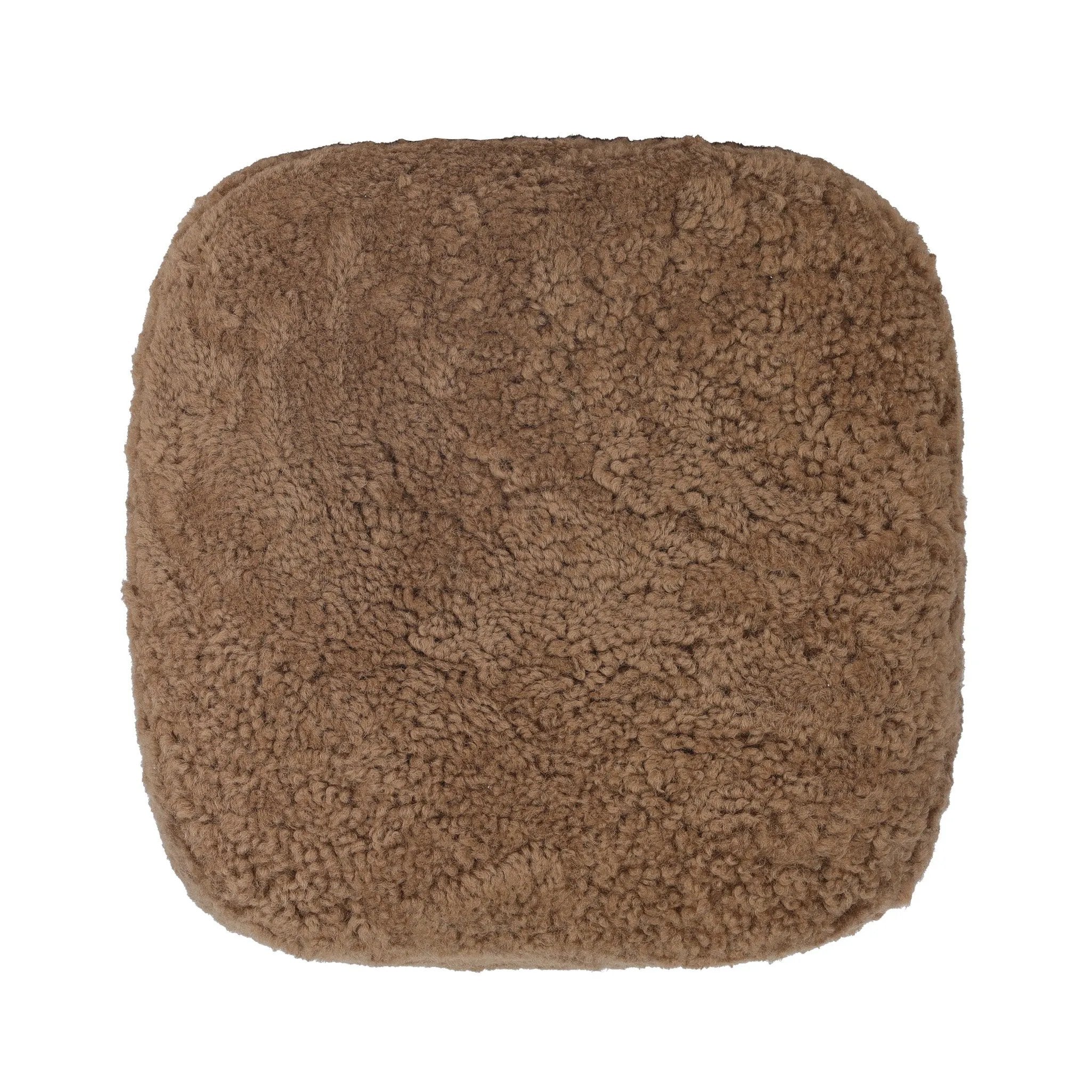 Small scale, big personality. This petite, shearling ottoman pairs a rounded upholstered seat with rugged, hammered black feet for a hand-crafted look.As lovers of modern materials at Amethyst, we love the nature inspired Joey Ottoman - Amber Shearling. This item pairs well with other brands such as Loloi Rugs and is perfect for coastal homes Amethyst Home provides interior design, new home construction design consulting, vintage area rugs, and lighting in the Los Angeles metro area.