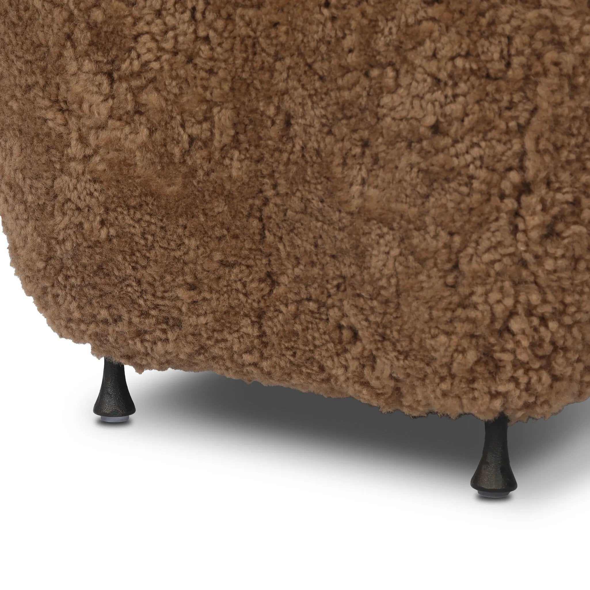 Small scale, big personality. This petite, shearling ottoman pairs a rounded upholstered seat with rugged, hammered black feet for a hand-crafted look.As lovers of modern materials at Amethyst, we love the nature inspired Joey Ottoman - Amber Shearling. This item pairs well with other brands such as Loloi Rugs and is perfect for coastal homes Amethyst Home provides interior design, new home construction design consulting, vintage area rugs, and lighting in the Seattle metro area.