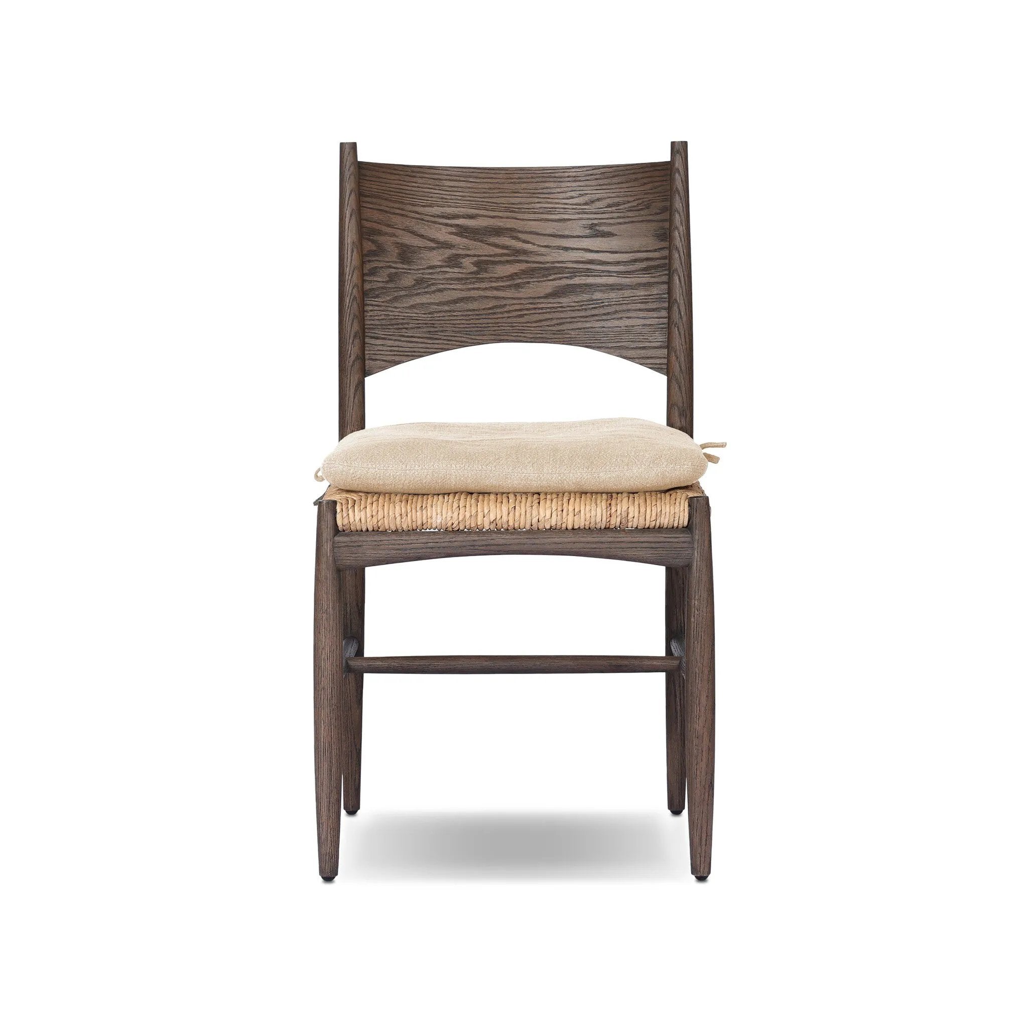 A seamless addition to your dining collection, a slim-profile dining chair pairs a woven banana leaf seat with a solid oak frame featuring a bentwood back. A tie-fasten seat cushion of high-performance fabric completes the look. Amethyst Home provides interior design, new home construction design consulting, vintage area rugs, and lighting in the Scottsdale metro area.