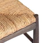 Featuring Jovan Stained Saddle Brown Dining Chair by Four Hands at Amethyst Home. A seamless addition to your dining collection, a slim-profile dining chair pairs a woven banana leaf seat with a solid oak frame featuring a bentwood back. Overall Dimensions: 20.00"w x 22.25"d x 37.00"h. Amethyst Home provides interior design, new home construction design consulting, vintage area rugs, and lighting in the Houston metro area.