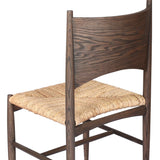 Featuring Jovan Stained Saddle Brown Dining Chair by Four Hands at Amethyst Home. A seamless addition to your dining collection, a slim-profile dining chair pairs a woven banana leaf seat with a solid oak frame featuring a bentwood back. Overall Dimensions: 20.00"w x 22.25"d x 37.00"h. Amethyst Home provides interior design, new home construction design consulting, vintage area rugs, and lighting in the Laguna Beach metro area.