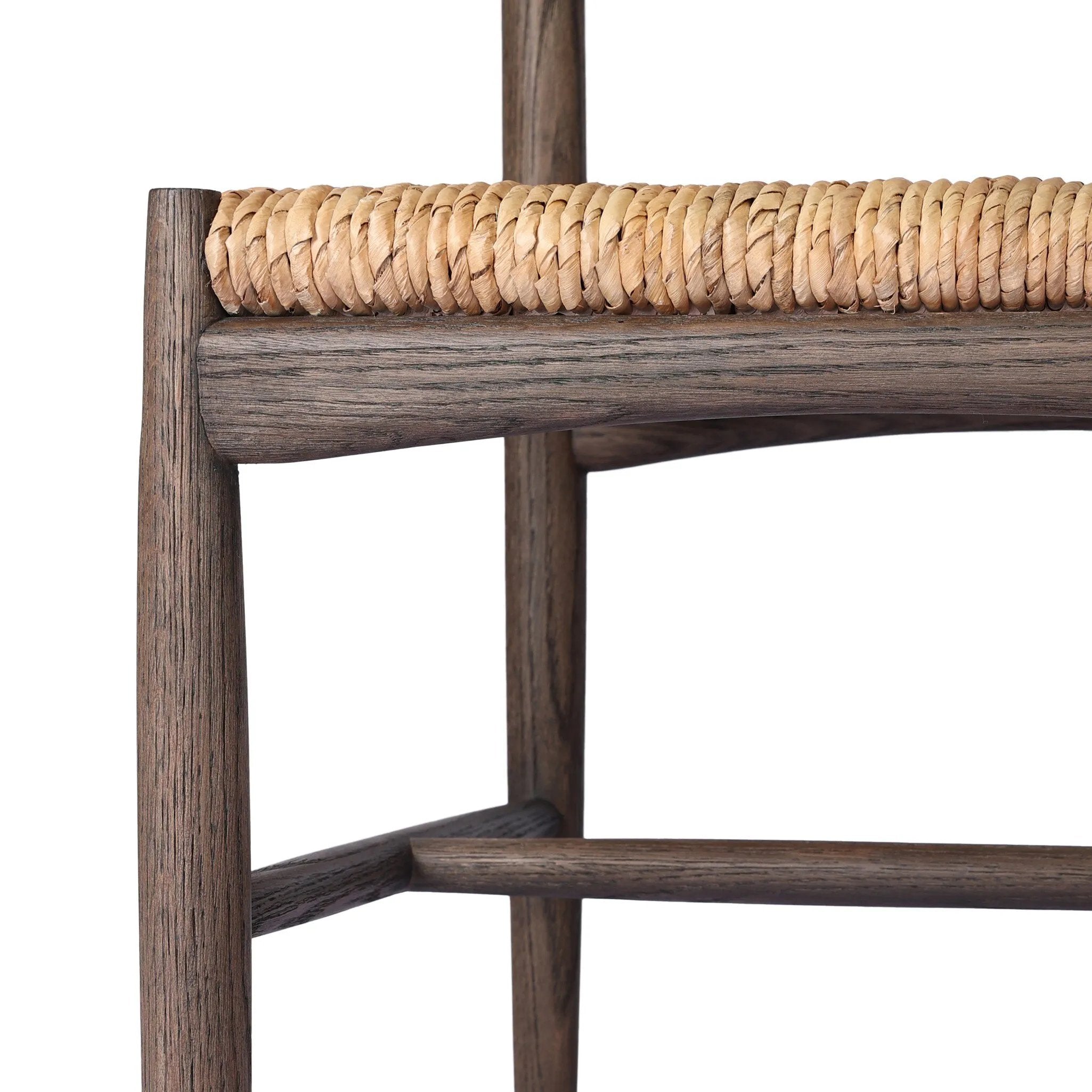 Featuring Jovan Stained Saddle Brown Dining Chair by Four Hands at Amethyst Home. A seamless addition to your dining collection, a slim-profile dining chair pairs a woven banana leaf seat with a solid oak frame featuring a bentwood back. Overall Dimensions: 20.00"w x 22.25"d x 37.00"h. Amethyst Home provides interior design, new home construction design consulting, vintage area rugs, and lighting in the Miami metro area.