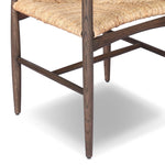 Featuring Jovan Stained Saddle Brown Dining Chair by Four Hands at Amethyst Home. A seamless addition to your dining collection, a slim-profile dining chair pairs a woven banana leaf seat with a solid oak frame featuring a bentwood back. Overall Dimensions: 20.00"w x 22.25"d x 37.00"h. Amethyst Home provides interior design, new home construction design consulting, vintage area rugs, and lighting in the Omaha metro area.
