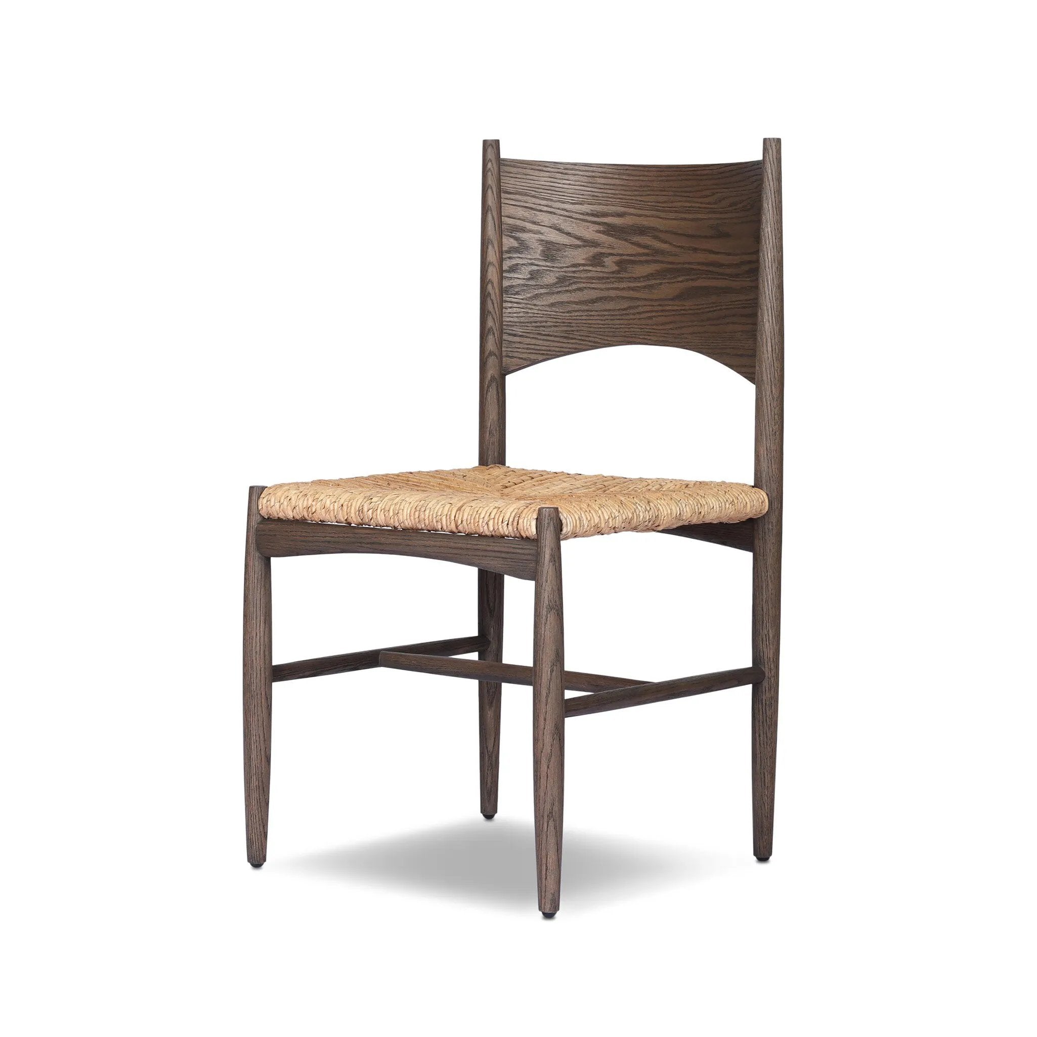 A seamless addition to your dining collection, a slim-profile dining chair pairs a woven banana leaf seat with a solid oak frame featuring a bentwood back Amethyst Home provides interior design, new home construction design consulting, vintage area rugs, and lighting in the Tampa metro area.