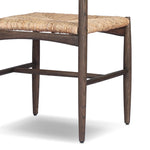 Featuring Jovan Stained Saddle Brown Dining Chair by Four Hands at Amethyst Home. A seamless addition to your dining collection, a slim-profile dining chair pairs a woven banana leaf seat with a solid oak frame featuring a bentwood back. Overall Dimensions: 20.00"w x 22.25"d x 37.00"h. Amethyst Home provides interior design, new home construction design consulting, vintage area rugs, and lighting in the Washington metro area.