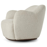 With a high, yarn-like pile that's soft to the touch, ivory upholstery pairs with an S-spring seat and enveloped frame for an inviting look and feel on this 360-degree swivel chair Amethyst Home provides interior design, new home construction design consulting, vintage area rugs, and lighting in the Houston metro area.