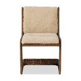Contours and cantilevers define this Seventies-inspired dining chair. A woven sculptural frame of natural rattan bolsters textural shearling cushions for max comfort.As fans of wabi sabi materials at Amethyst, we love the warm modern inspired Katrine Dining Chair - Beige Shorn Shearling. Amethyst Home provides interior design, new home construction design consulting, vintage area rugs, and lighting in the Houston metro area.