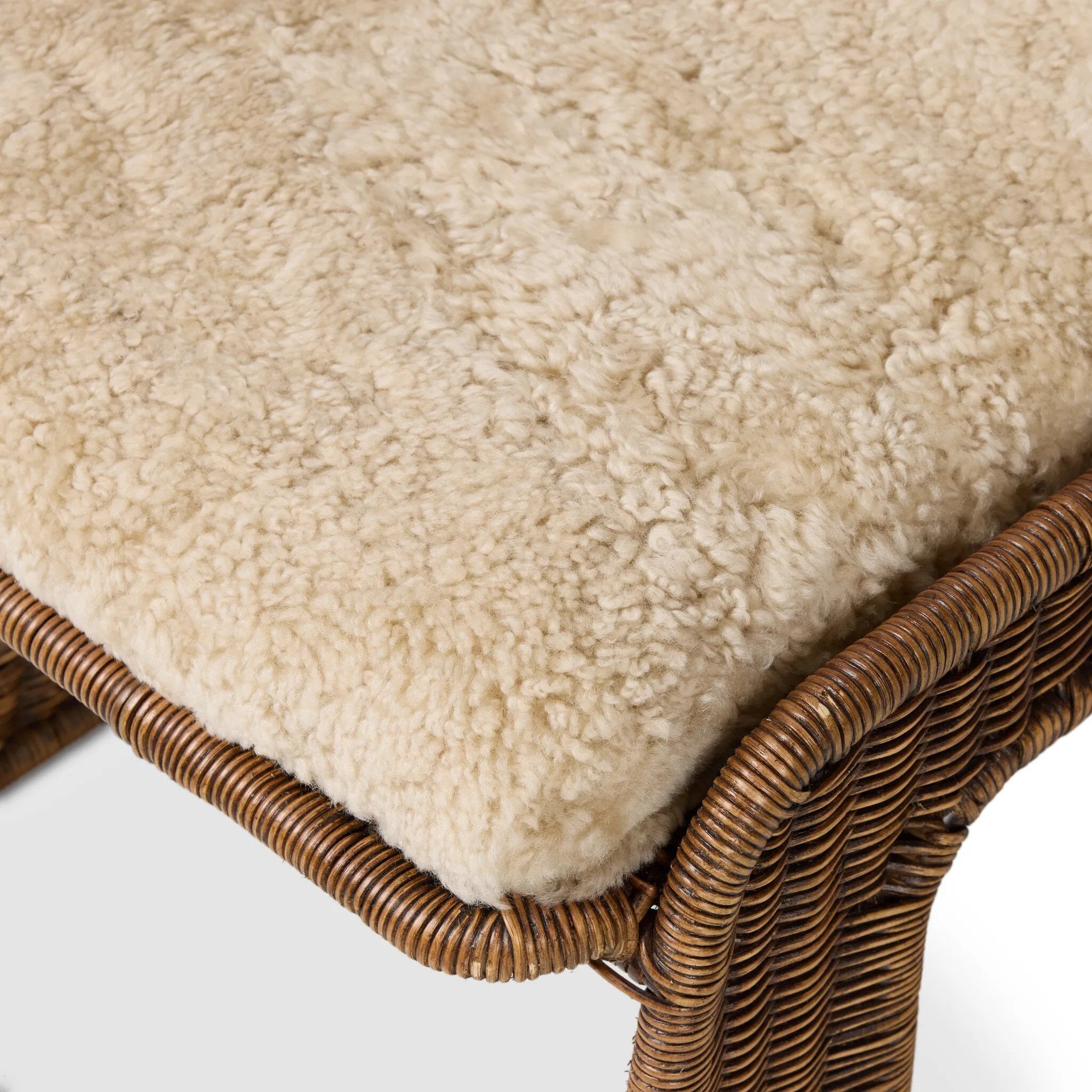 Contours and cantilevers define this Seventies-inspired dining chair. A woven sculptural frame of natural rattan bolsters textural shearling cushions for max comfort.As fans of wabi sabi materials at Amethyst, we love the warm modern inspired Katrine Dining Chair - Beige Shorn Shearling. Amethyst Home provides interior design, new home construction design consulting, vintage area rugs, and lighting in the Nashville metro area.